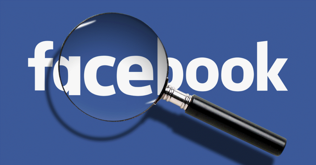 Lupa sobre el logo de Facebook